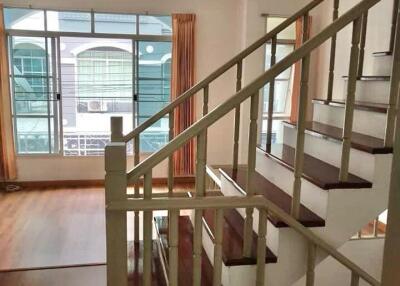 Interior living area with staircase and large window