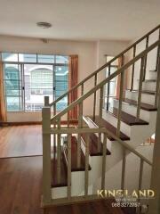 Interior living area with staircase and large window