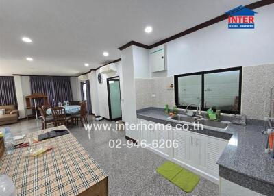 Modern kitchen with dining and living area