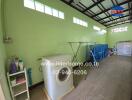 Laundry room with washing machine and storage area