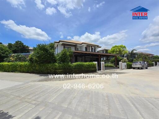 Exterior view of a property with driveway and carport