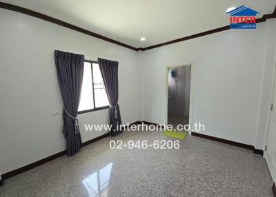 Main living area with window and doorway