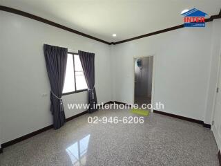 Main living area with window and doorway