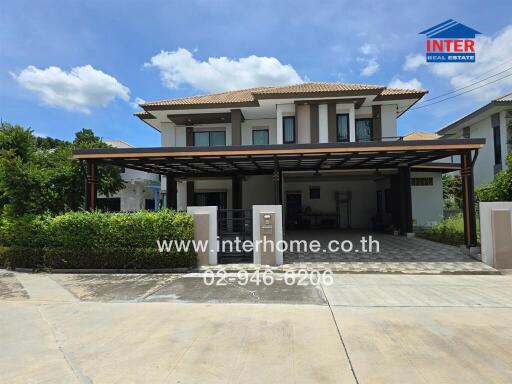 Two-story house exterior with covered parking