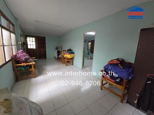 Living room with tiled floor and basic furniture