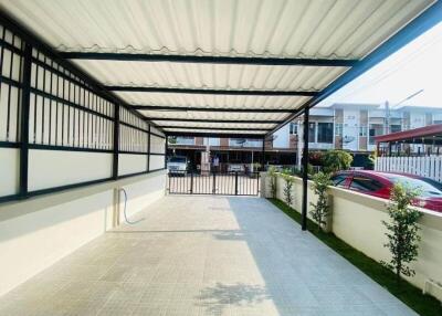 Covered carport with gated entrance