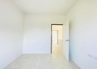 Empty bedroom with open door