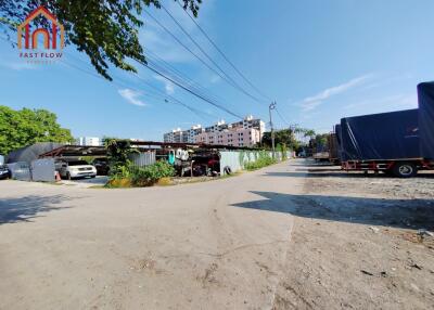 Outdoor view of the surrounding area with buildings and parked vehicles