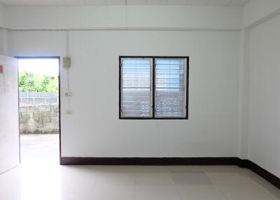 Simple minimalist empty living room with window and open door