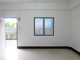 Simple minimalist empty living room with window and open door