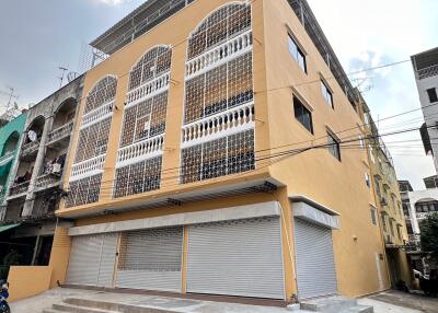 Exterior view of a multi-story building with balconies