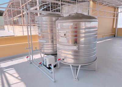 Stainless steel water tanks on a rooftop