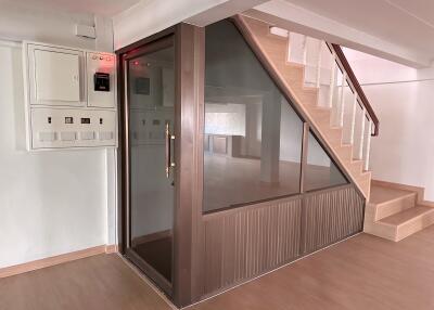 Modern interior with a glass elevator and staircase