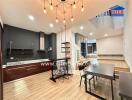 Modern kitchen and dining area with contemporary lighting