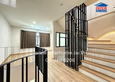 Main living area with modern staircase