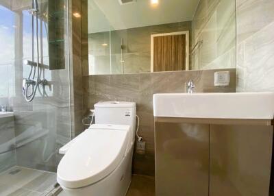 Modern bathroom with glass shower and vanity area