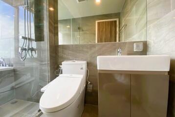 Modern bathroom with glass shower and vanity area