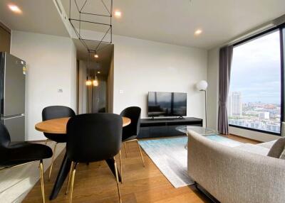 Modern living room with dining area and large window