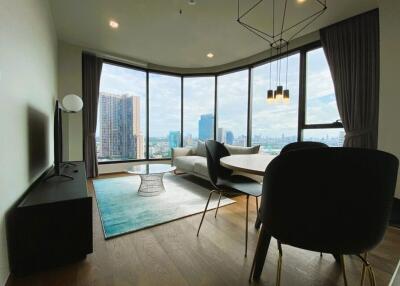 Modern living room with large windows and city view