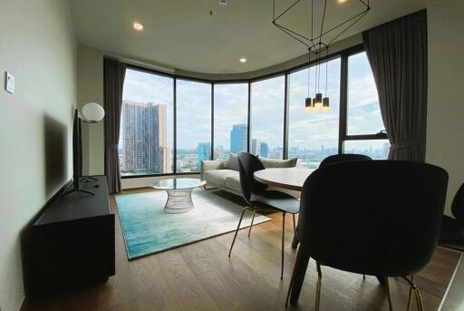 Modern living room with large windows and city view