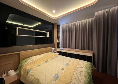 Modern bedroom with ambient lighting and work desk