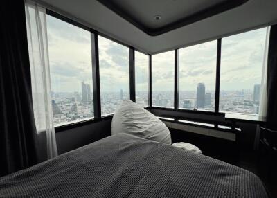 Spacious bedroom with panoramic city view