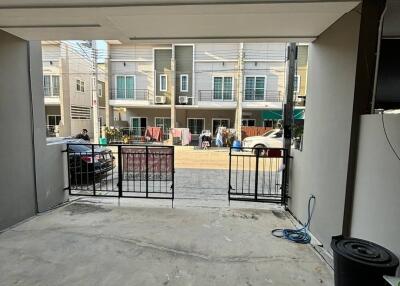 View from inside a garage towards a residential street