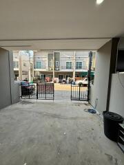 View from inside a garage towards a residential street