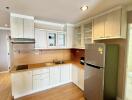 Modern kitchen with wooden cabinetry and stainless steel appliances