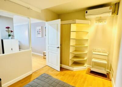 Modern bedroom with storage and air conditioning