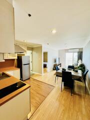 Open-plan kitchen and living area with dining table