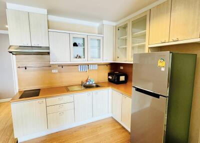 Modern kitchen with wooden cabinets and appliances