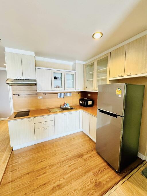 Modern kitchen with wooden cabinets and appliances