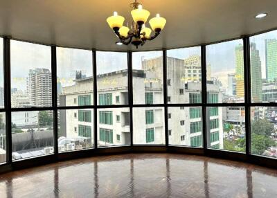 Large windowed area with city view and chandelier