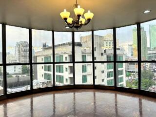 Large windowed area with city view and chandelier