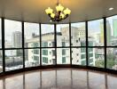 Large windowed area with city view and chandelier