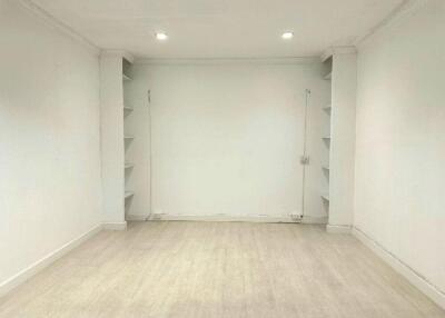 Empty room with shelves and downlights