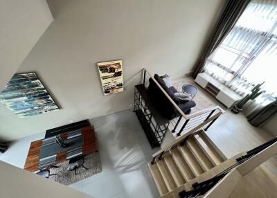 Modern living room with dining area and stairs