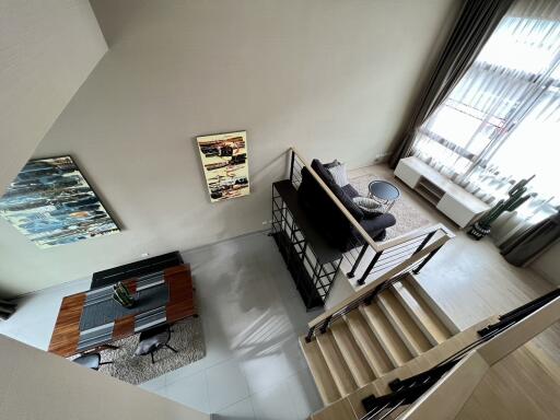 Modern living room with dining area and stairs