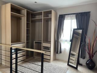 Spacious bedroom with walk-in closet and large window