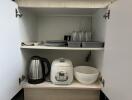 Kitchen cabinet with small appliances and dishes