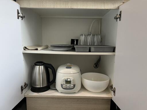 Kitchen cabinet with small appliances and dishes