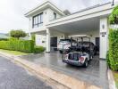 Modern house with driveway and parked cars