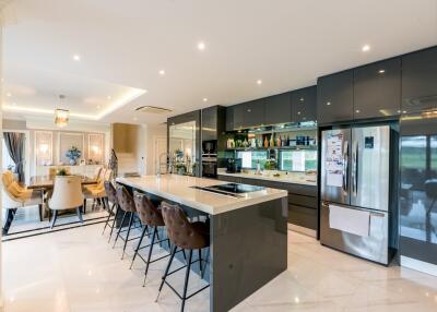 Modern kitchen and dining area with sleek design and high-end appliances