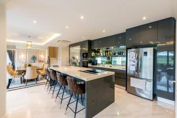 Modern kitchen and dining area with sleek design and high-end appliances