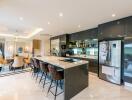 Modern kitchen and dining area with sleek design and high-end appliances