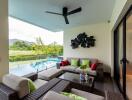 Outdoor living space with a view of the pool and greenery