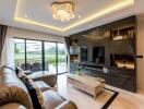 Modern living room with leather sofas, large TV, and sliding glass doors to outdoor patio.