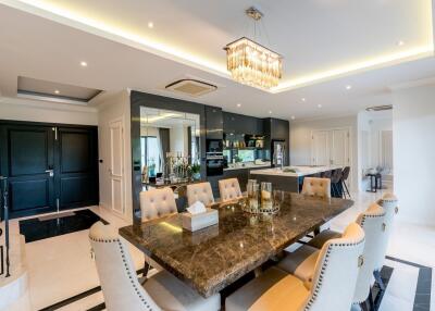 Luxurious dining area with a modern open kitchen