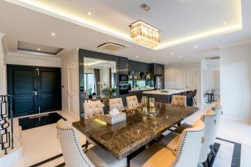 Luxurious dining area with a modern open kitchen